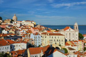 View of Lisbon famous postcard iconic view from Miradouro de Santa Luzia tourist viewpoint over Alfama old city district. Lisbon, Portugal.