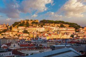 View of Lisbon city from Miradouro de Sao Pedro de Alcantara viewpoint on sunset. Lisbon, Portugal.